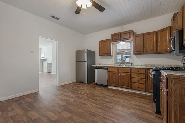 kitchen featuring sink, wood ceiling, dark wood-type flooring, ceiling fan, and stainless steel appliances