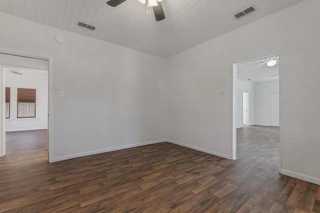 unfurnished room with ceiling fan and dark hardwood / wood-style flooring