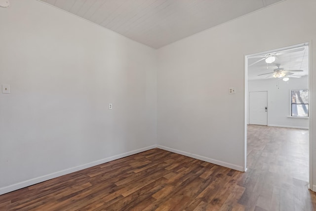 unfurnished room with dark hardwood / wood-style floors and ceiling fan