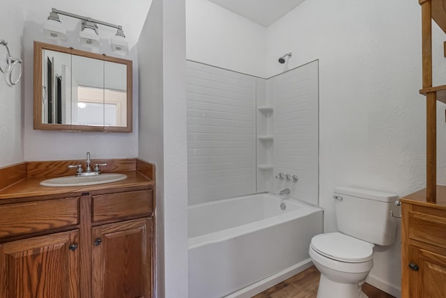 full bathroom featuring toilet, vanity, and  shower combination