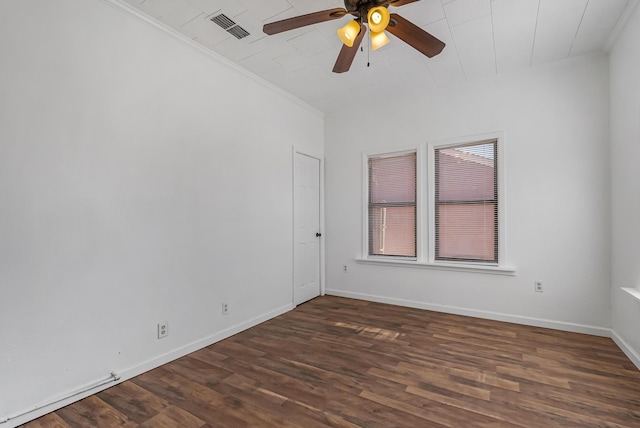 unfurnished room with ceiling fan, ornamental molding, and dark hardwood / wood-style floors