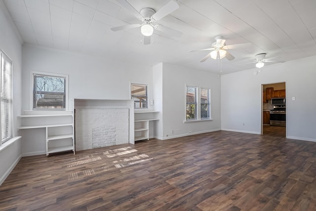 unfurnished living room featuring ceiling fan and dark hardwood / wood-style flooring