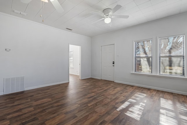 spare room featuring ornamental molding, dark hardwood / wood-style floors, and ceiling fan