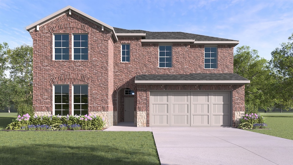 view of front of home with a garage and a front lawn