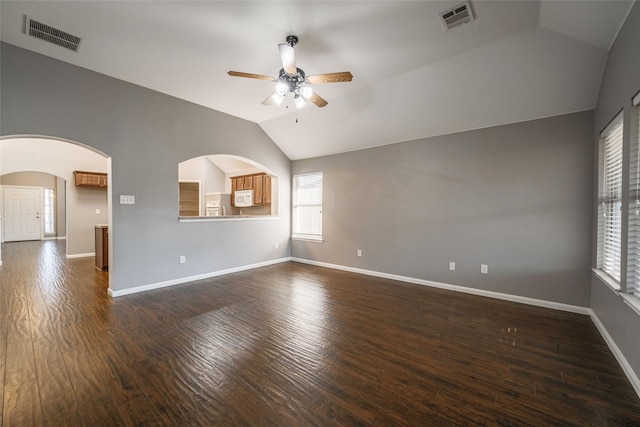 unfurnished room featuring ceiling fan, lofted ceiling, and dark hardwood / wood-style floors