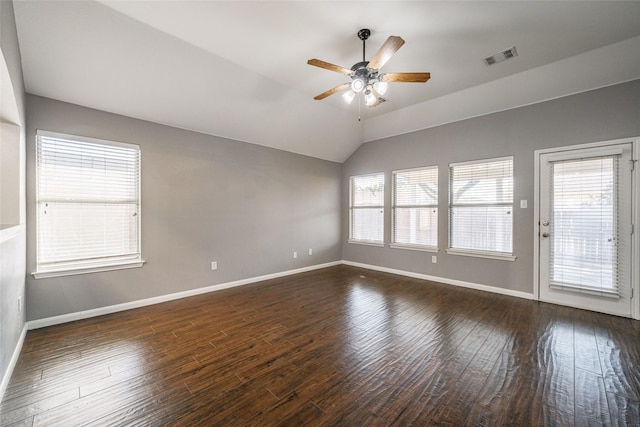 spare room featuring vaulted ceiling, ceiling fan, and dark hardwood / wood-style flooring