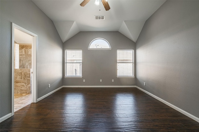 unfurnished room with ceiling fan, lofted ceiling, and dark hardwood / wood-style flooring