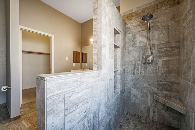 bathroom with tiled shower