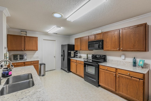 kitchen featuring sink, crown molding, black appliances, light stone countertops, and a textured ceiling