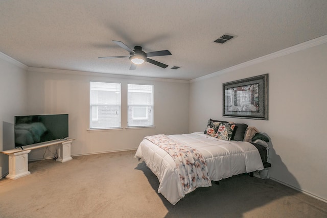 bedroom featuring crown molding, light colored carpet, and a textured ceiling