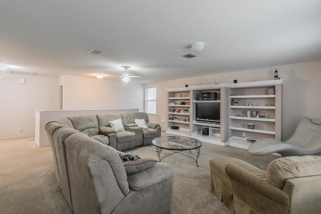 living room with ceiling fan and light carpet