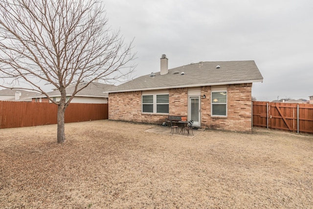 back of house with a patio area