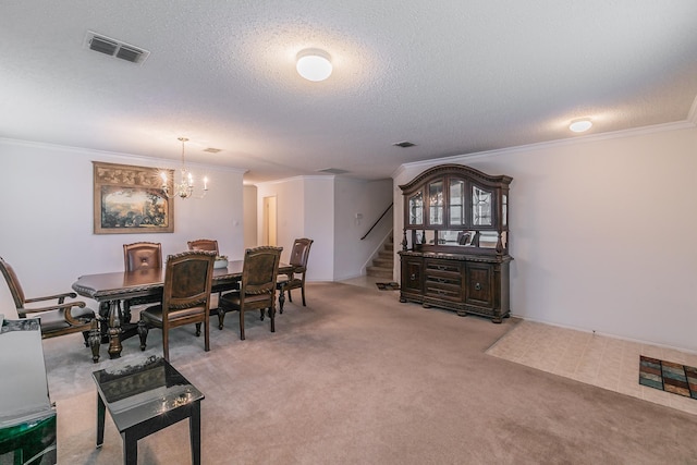 dining space featuring crown molding, a chandelier, light colored carpet, and a textured ceiling