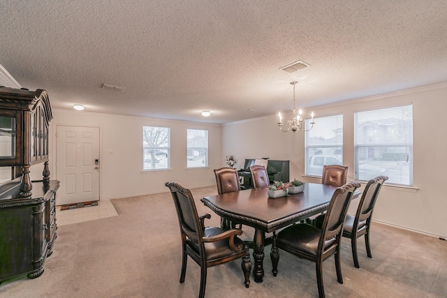 carpeted dining area featuring crown molding, an inviting chandelier, and a textured ceiling