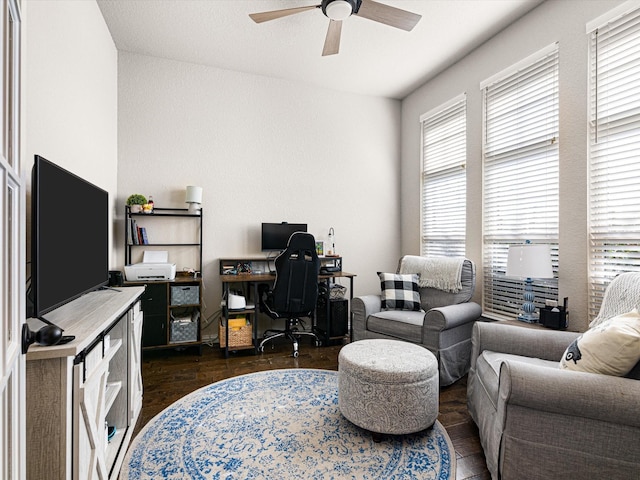 office with dark hardwood / wood-style flooring and ceiling fan