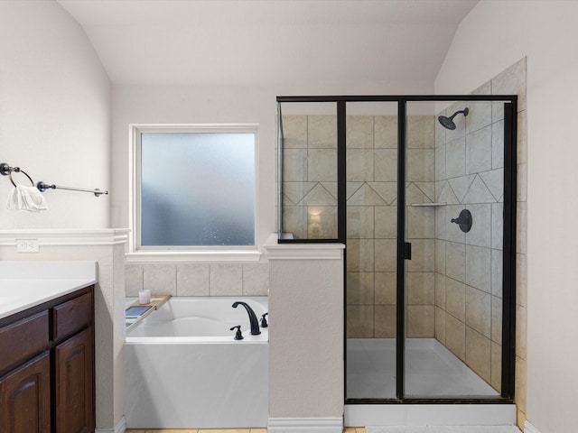 bathroom with vanity, plus walk in shower, and vaulted ceiling