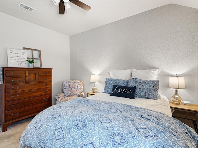 bedroom with light carpet, lofted ceiling, and ceiling fan