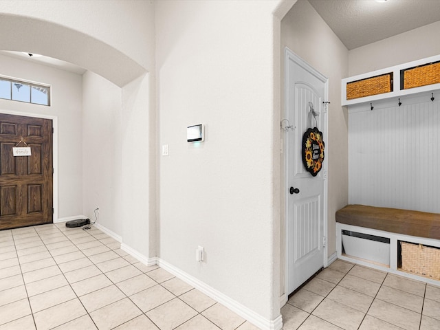 mudroom featuring light tile patterned flooring