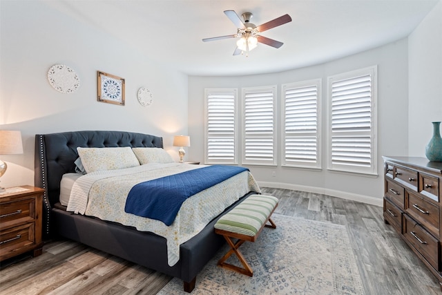 bedroom featuring wood-type flooring and ceiling fan