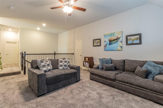 living room with vaulted ceiling, carpet flooring, and ceiling fan