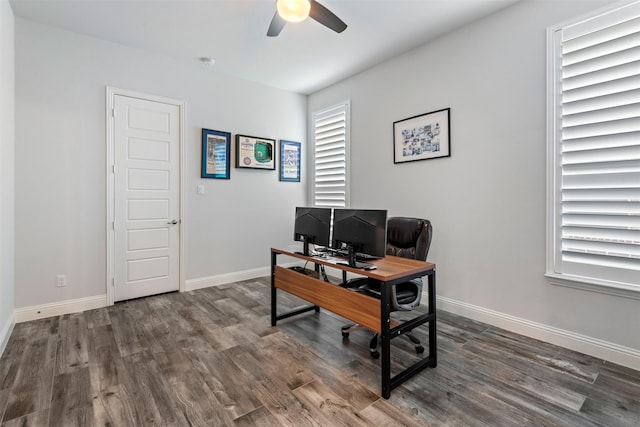 office area with dark wood-type flooring and ceiling fan