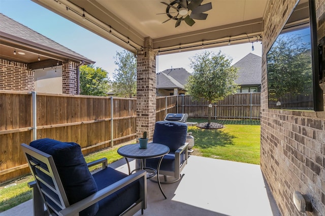 view of patio featuring ceiling fan