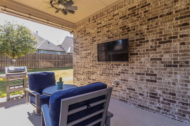 view of patio featuring ceiling fan