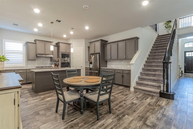 dining room featuring dark hardwood / wood-style flooring and sink