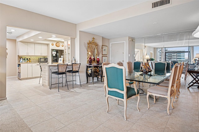 dining area featuring light tile patterned floors