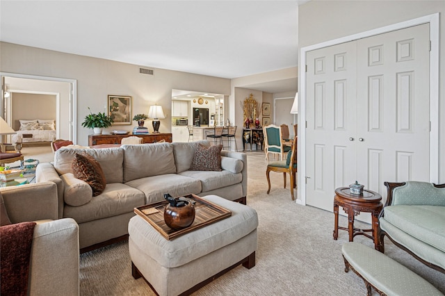 living room with light colored carpet