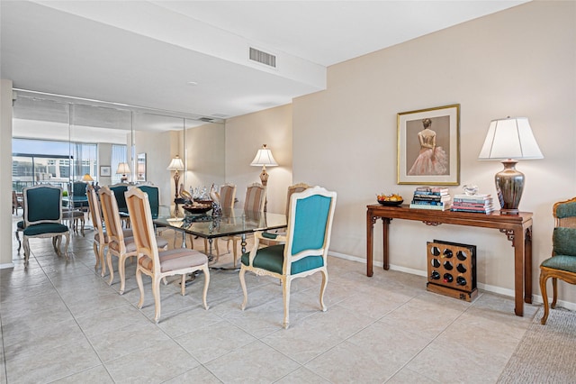 dining area with light tile patterned flooring