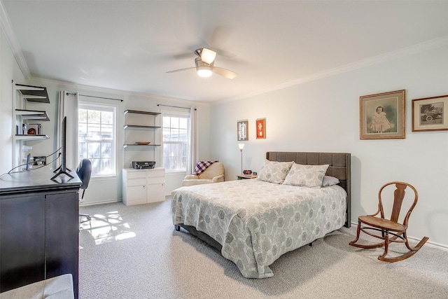 carpeted bedroom featuring ornamental molding and ceiling fan