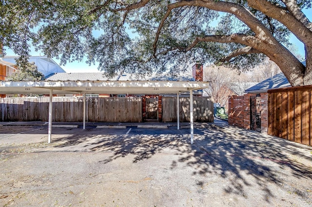 rear view of house with a carport