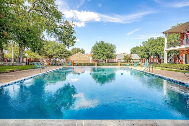 view of swimming pool featuring a patio area