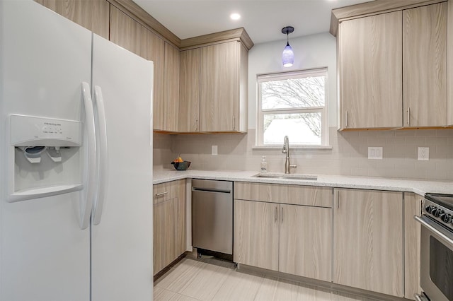 kitchen with light brown cabinetry, decorative light fixtures, sink, white refrigerator with ice dispenser, and electric range