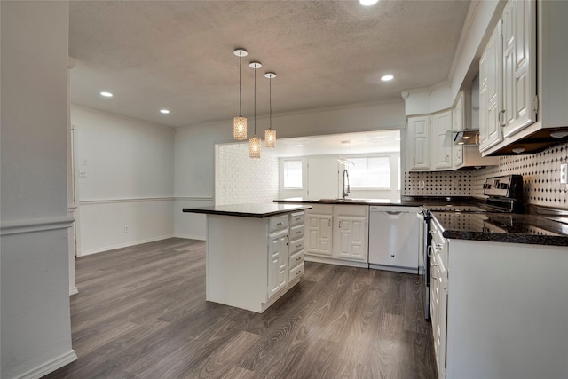 kitchen with a kitchen island, white cabinetry, sink, hanging light fixtures, and white dishwasher