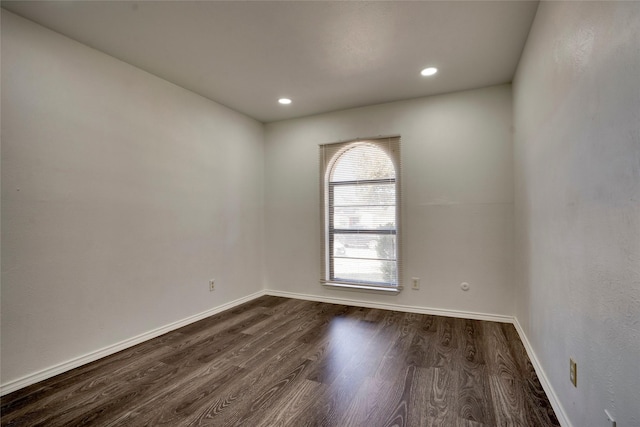 empty room featuring dark wood-type flooring