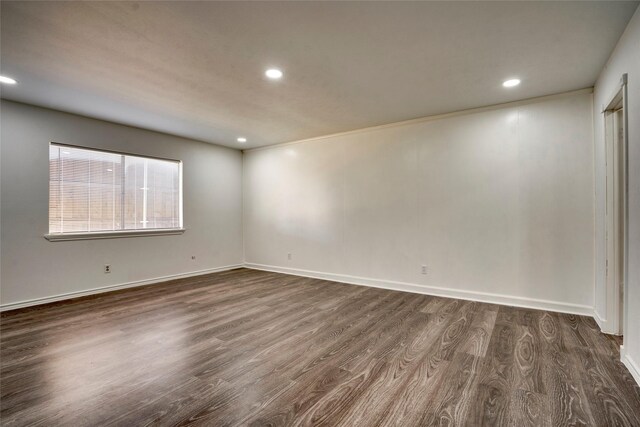 empty room featuring dark wood-type flooring