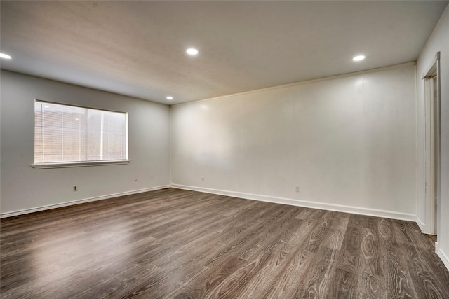 spare room featuring dark wood-type flooring