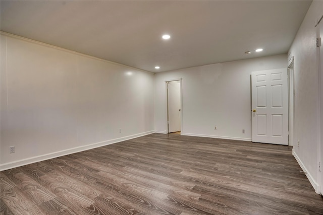 empty room with dark hardwood / wood-style floors