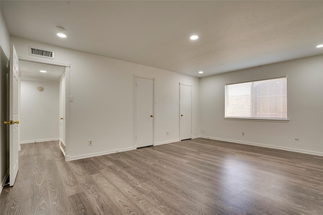 spare room featuring light hardwood / wood-style flooring