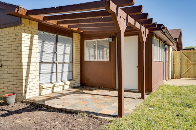 view of side of property with a pergola and a patio