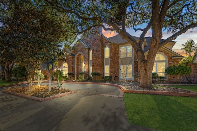 tudor home with a yard