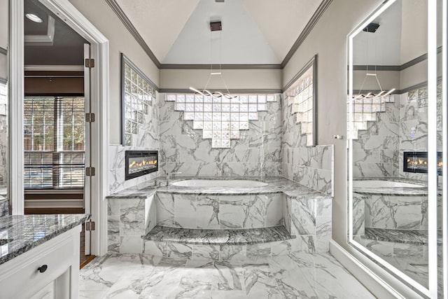 bathroom with lofted ceiling, a bath, crown molding, and vanity