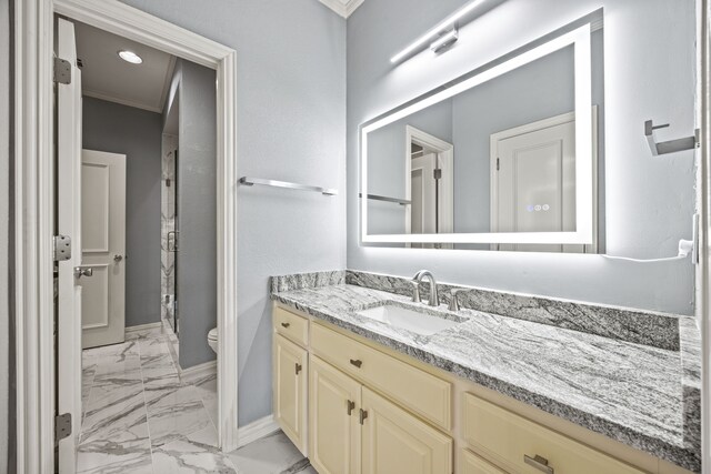 bathroom with vanity, walk in shower, crown molding, and toilet