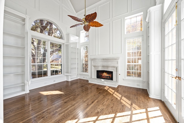 unfurnished sunroom featuring lofted ceiling, french doors, and ceiling fan