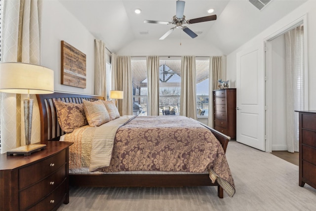 bedroom featuring vaulted ceiling, light colored carpet, and ceiling fan