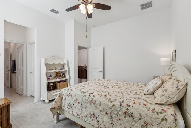 bedroom featuring light colored carpet and ceiling fan