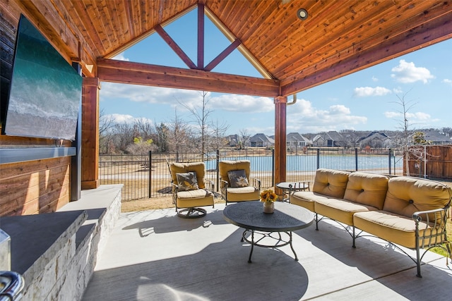 view of patio / terrace featuring a water view, outdoor lounge area, and a gazebo