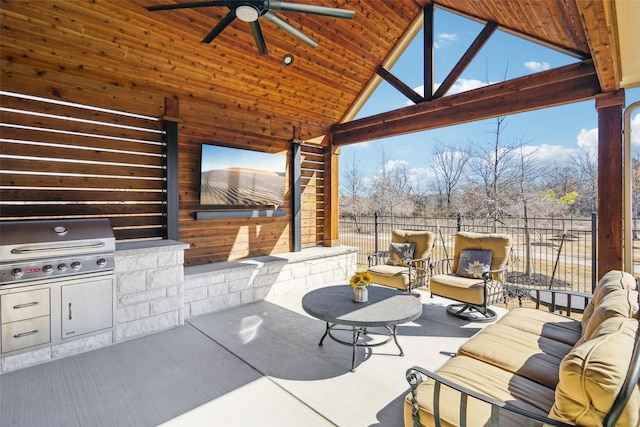 view of patio / terrace with an outdoor living space, an outdoor kitchen, area for grilling, and ceiling fan